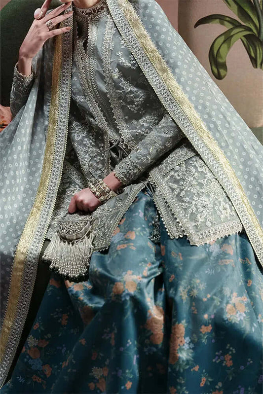 Selineh double shirt outfit featuring a grey organza jacket, blue floral skirt, and intricate embroidery.