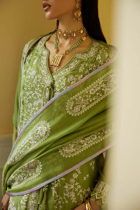 Minha green kurta with intricate embroidery, paired with a matching dupatta and traditional jewelry.