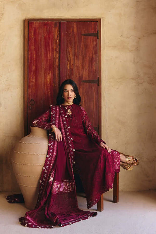 Sehaz maroon outfit featuring a double layered kurta, embroidered dupatta, and culottes, styled elegantly against a rustic backdrop.