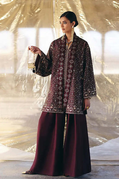 Orana chocolate amber silk faux front open jacket with intricate blue designs and floral hem, paired with matching silk pants.