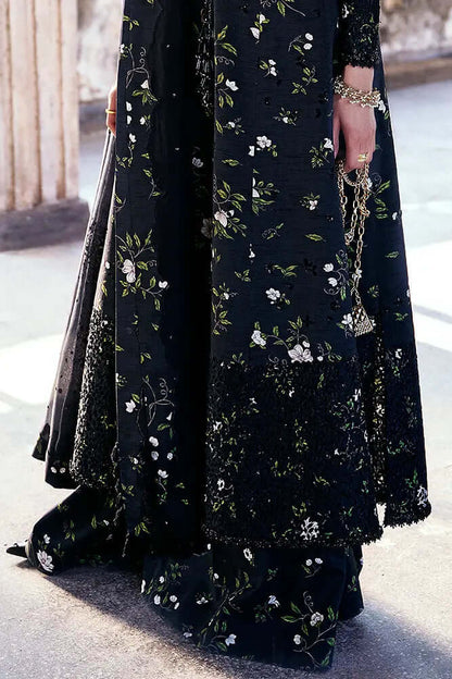 Zeyara raven black silk outfit featuring intricate floral embroidery and lace details.