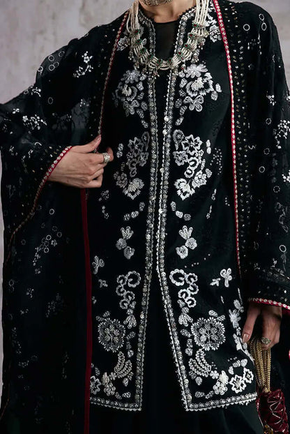 Zaarish elegant jet black cape with black and white embroidery, lacework, and silver embellishments.