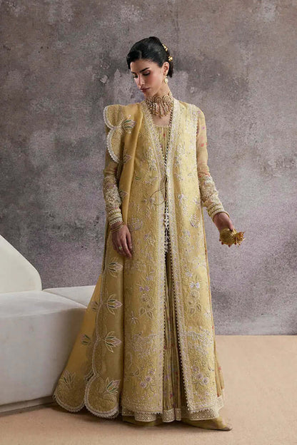Urah straight lemon yellow gown with embroidered sleeveless jacket, flowy A-line inner shirt, and floral silk pants.