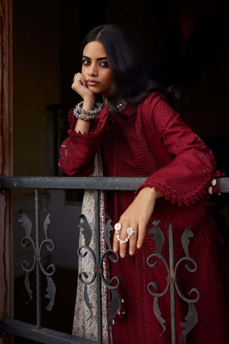 Feeha deep red cutwork shirt with a printed dupatta and stylish accessories, showcasing elegance and modernity.