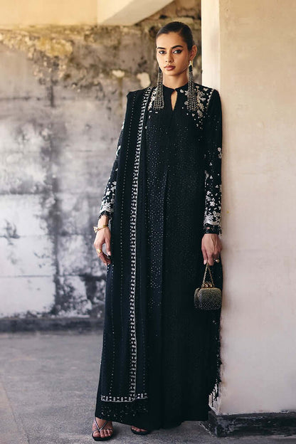 Vivora Midnight Black silk A-line shirt with embroidery, tassels, and textured design, paired with cigarette pants.