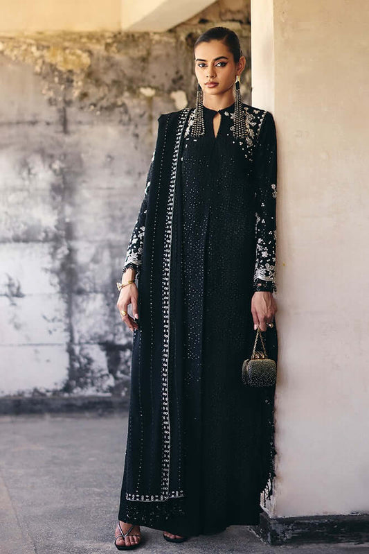 Vivora Midnight Black silk A-line shirt with embroidery, tassels, and textured design, paired with cigarette pants.