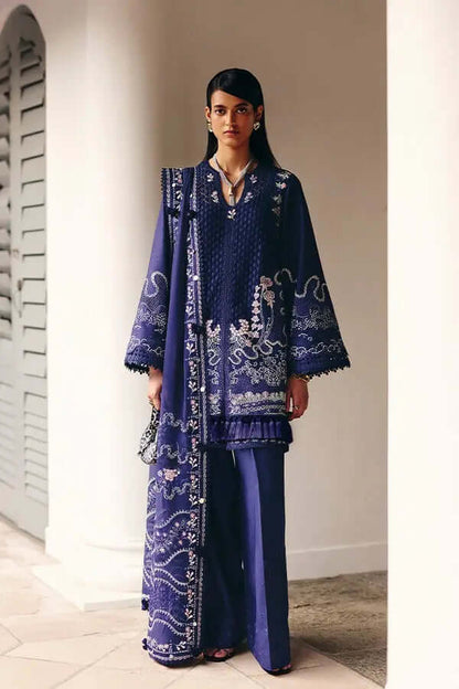 Sahra Midnight Blue A-line shirt with lace accents, paired with matching pants and dupatta featuring modern patterns.