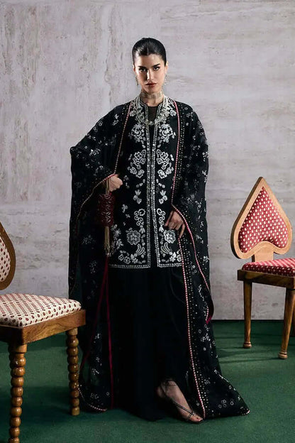 Model wearing Zaarish silk short shirt with embroidered cape and cigarette pants, embodying elegance and sophistication.
