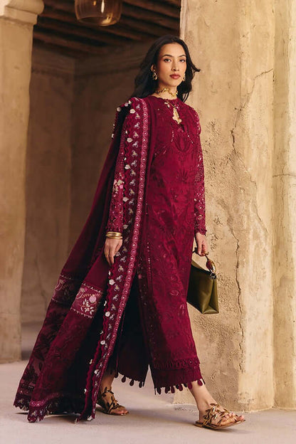 Sehaz maroon outfit with embroidery, featuring a long cape and stylish accessories, perfect for Eid celebrations.