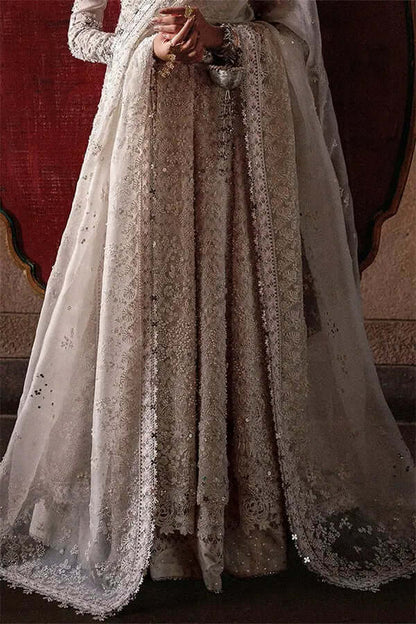 Zehrell white organza pishwaas with scalloped hem, layered cutwork finish, adorned with sequins and pearls.