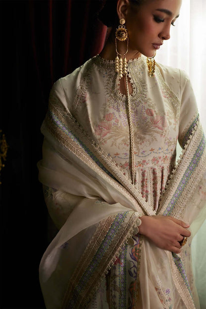 Elegant Safira pishwas with floral prints, paired with an embroidered dupatta and stylish earrings.