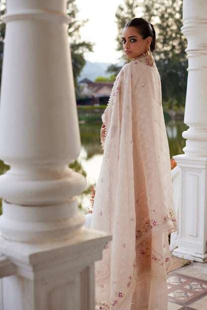Elegant woman wearing the Melina powder pink kurta with organza dupatta, showcasing chic embroidery.