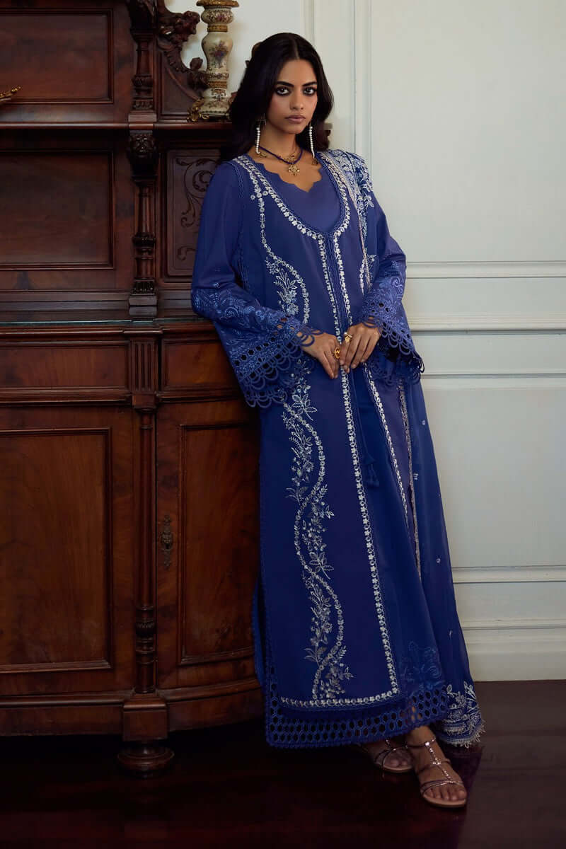 Elegant deep periwinkle Eslem dress with intricate embroidery and lace accents, paired with stylish accessories.