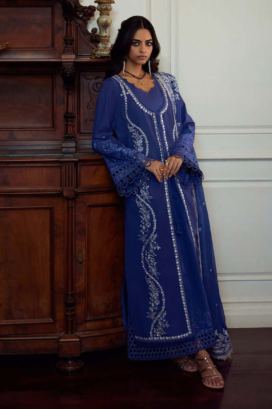 Elegant deep periwinkle Eslem dress with intricate embroidery and lace accents, paired with stylish accessories.